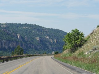 Medium close up of a winding road at the Bighorn Mountains in Wyoming.