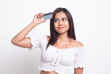 Fototapeta premium Young Asian woman think with a blank card.