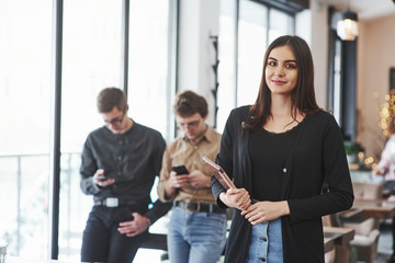 Obraz premium Conception of business and start up. Group of students in eyewear standing in the learning room at daytime