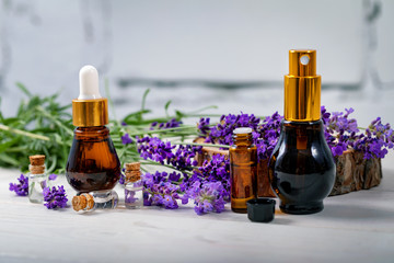 lavender perfume - essential oil and scent bottles with flowers