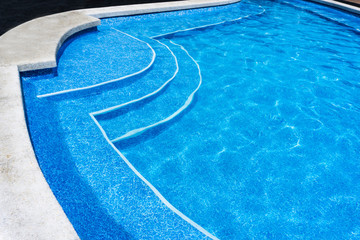 Blue surface water in the pool. Edge the pool.