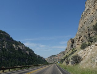 Scenic views along the road through the Bighorn Mountains in Wyoming, with incredible rock formations on both sides of the road. 