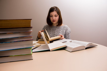 student girl with stack of books