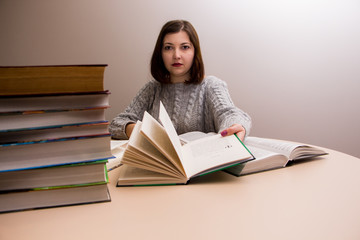 student girl with stack of books