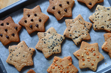 Homemade star shape cookies on baking tray