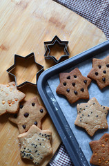 Homemade star shape cookies on baking tray