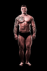 Obraz na płótnie Canvas in full growth. beautiful strong man bodybuilder