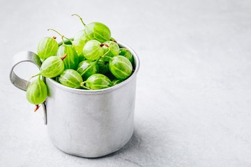 Ripe fresh organic gooseberry berry in a cup