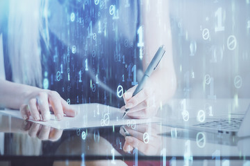 Double exposure of woman's writing hand on background with data technology hud. Big data concept.