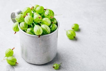 Ripe fresh organic gooseberry berry in a cup