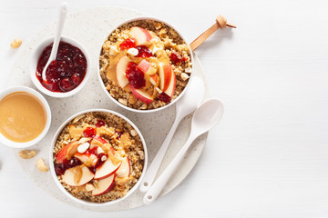 apple peanut butter quinoa bowl with jam and cashew for healthy breakfast