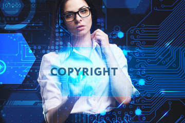 The concept of business, technology, the Internet and the network. A young entrepreneur working on a virtual screen of the future and sees the inscription: Copyright
