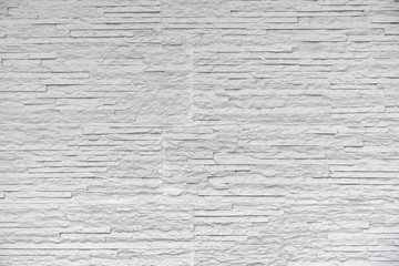 Obraz premium White classic stone brick are arranged to pattern on the wall for beautiful minimal and simple background.