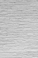 White classic stone brick are arranged to pattern on the wall for beautiful minimal and simple background.