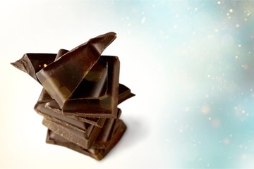 Delicious chocolates isolated on background