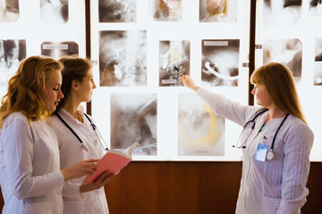 group of nurse studying the sections of the brain. The concept of health education. Students in the...