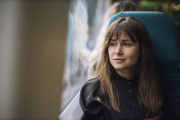 Portrait of a young woman in the train.