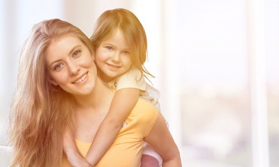 Happy smile mother and daughter hugging