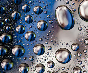 Colored Water Drops on a smooth glass surface