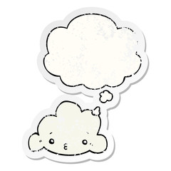 Fototapeta premium cartoon cloud and thought bubble as a distressed worn sticker