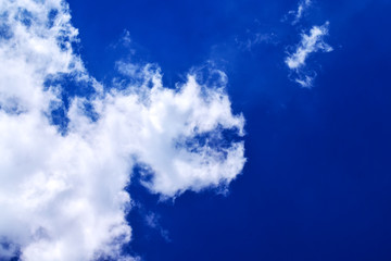 Soaring clouds in the bright blue sky