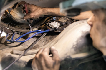 Obraz premium Car repair, fuel tank installation, fuel pump removal