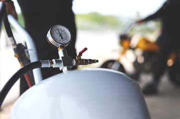 pressure meter of air compressor with soft-focus and over light in the background