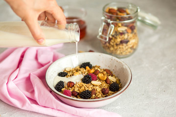 Granola with yogurt, honey and berries. Breakfast with berries and nuts. The correct breakfast. Delicious dish in the morning