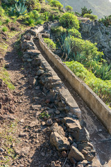 Irrigation canal for watering terraced fields in the Barranco de Argaga, the Argaga canyon on the island of La Gomera