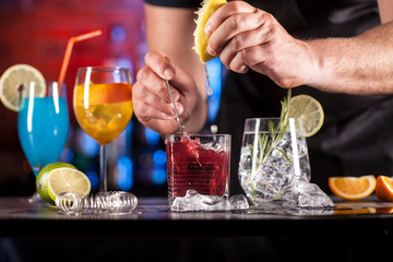 Set with different cocktails on bar tender