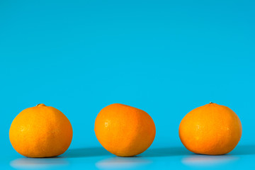 Summer of orange fruit on blue background.