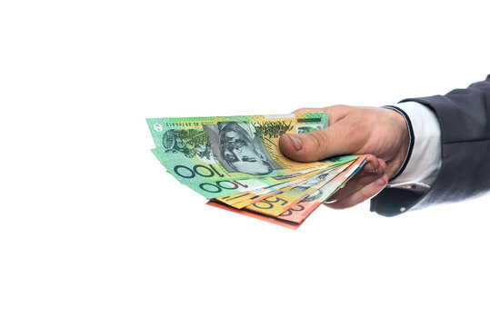 Australian dollars in male hand isolated on white
