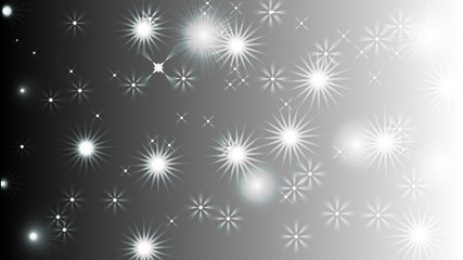 Black abstract light background with glittery colored shiny bokeh stars.
