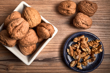 group of tasty nuts next to a bowl