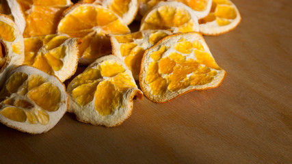 Natural Oranges Dried Sliced on a Wooden Background 