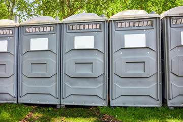 Fiberglass reinforced polymer mobile toilette cabins in a park