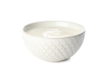 Bowl with cream yogurt isolated on white background