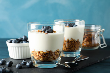 Composition with parfaits desserts against light blue background