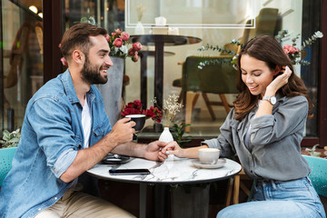 Attractive young couple in love having lunch