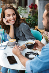 Attractive young couple in love having lunch