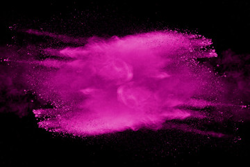 Explosion of pink dust on black background. - 276365132