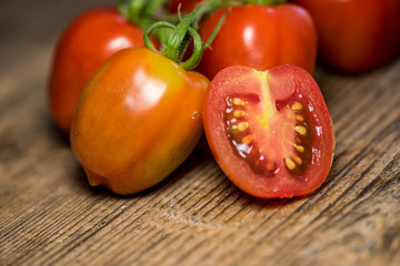 Fresh tomatoes on wood background