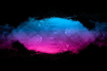 Explosion of multicolored dust on black background. - 276365160