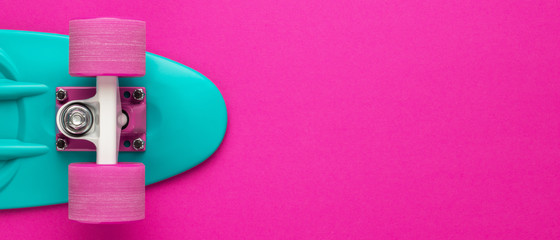 mini cruiser board on deep pink back