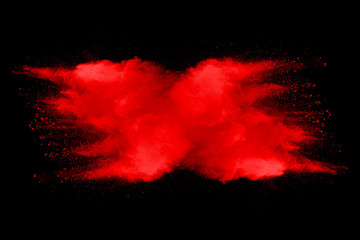 Explosion of red dust on black background. - 276365357