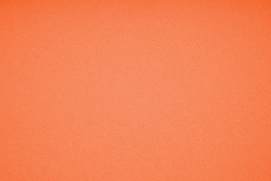 orange colored paperboard with paper texture background pattern