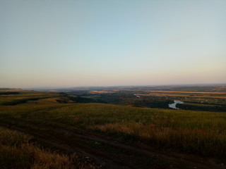 sunrise over the green field