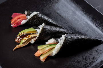 Sushi temaki with avocado on black © rostyslav84