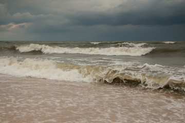 Storm waves on the sandy shore of the Azov sea