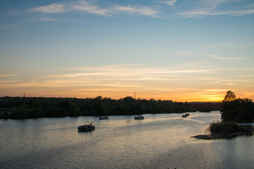 Fototapeta premium View over boats at Colorado river at sunset, Texas.